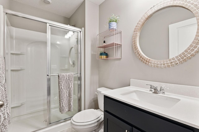 515 Goldenrod Trl, Waconia, MN 55387 - bathroom featuring vanity, toilet, a shower stall, and a textured ceiling