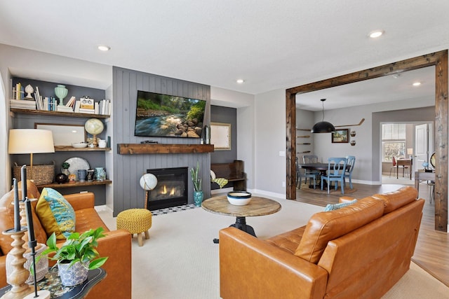 515 Goldenrod Trl, Waconia, MN 55387 - living room with a fireplace, baseboards, recessed lighting, and wood finished floors