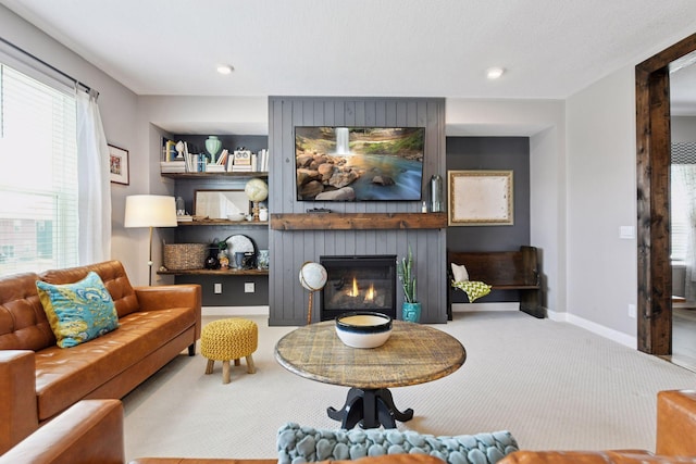 515 Goldenrod Trl, Waconia, MN 55387 - carpeted living room with a large fireplace, baseboards, and recessed lighting