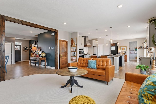 515 Goldenrod Trl, Waconia, MN 55387 - living room with light wood finished floors, baseboards, and recessed lighting