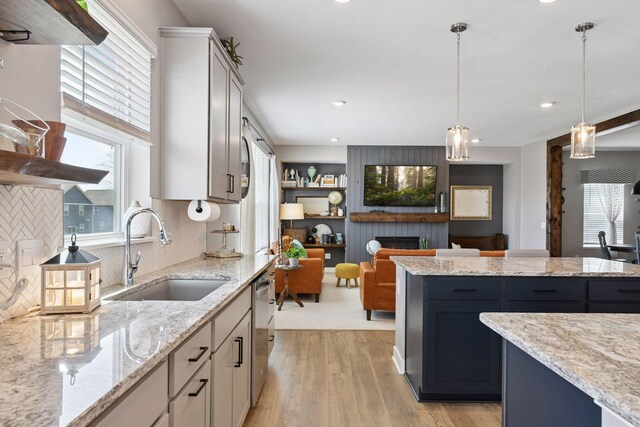 515 Goldenrod Trl, Waconia, MN 55387 - kitchen featuring a sink, dishwasher, plenty of natural light, decorative backsplash, and recessed lighting