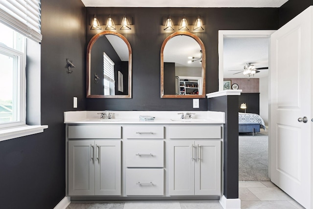 515 Goldenrod Trl, Waconia, MN 55387 - ensuite bathroom with a ceiling fan, double vanity, and tile patterned flooring
