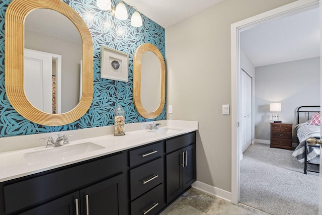 515 Goldenrod Trl, Waconia, MN 55387 - bathroom featuring wallpapered walls, double vanity, baseboards, and ensuite bath