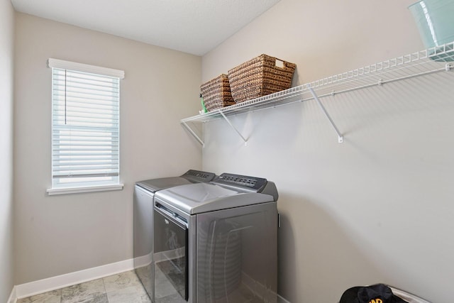 515 Goldenrod Trl, Waconia, MN 55387 - laundry room with separate washer and dryer, baseboards, and healthy amount of natural light