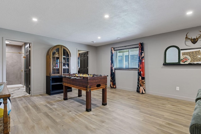 515 Goldenrod Trl, Waconia, MN 55387 - playroom with a textured ceiling, light wood-type flooring, recessed lighting, and baseboards