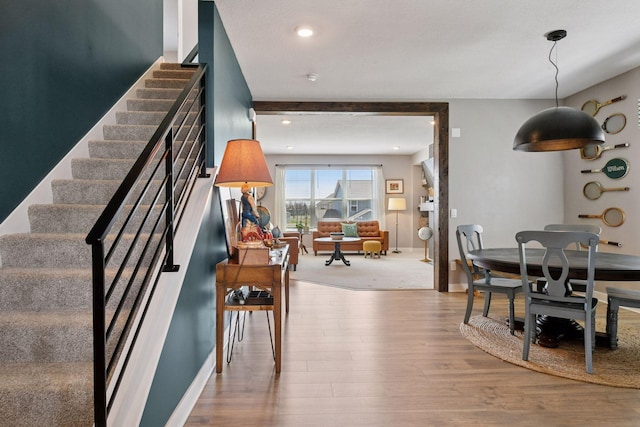 515 Goldenrod Trl, Waconia, MN 55387 - dining area with stairs, wood finished floors, baseboards, and recessed lighting