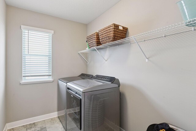 515 Goldenrod Trl, Waconia, MN 55387 - laundry room featuring separate washer and dryer and baseboards