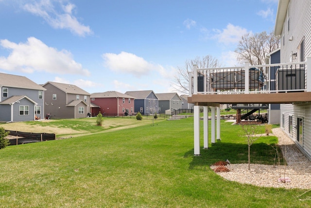 515 Goldenrod Trl, Waconia, MN 55387 - view of green lawn featuring a residential view, a deck, and stairway