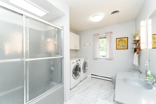 8706 Town Hall Rd NW, Byron, MN 55920 - washroom featuring washing machine and clothes dryer, baseboard heating, light marble finish floors, and a sink