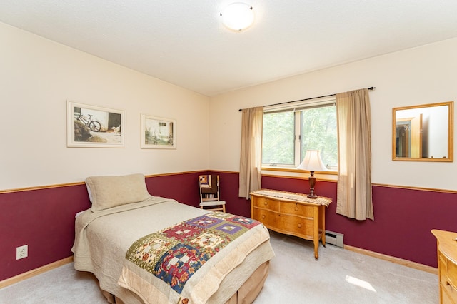 8706 Town Hall Rd NW, Byron, MN 55920 - carpeted bedroom with a baseboard heating unit and baseboards