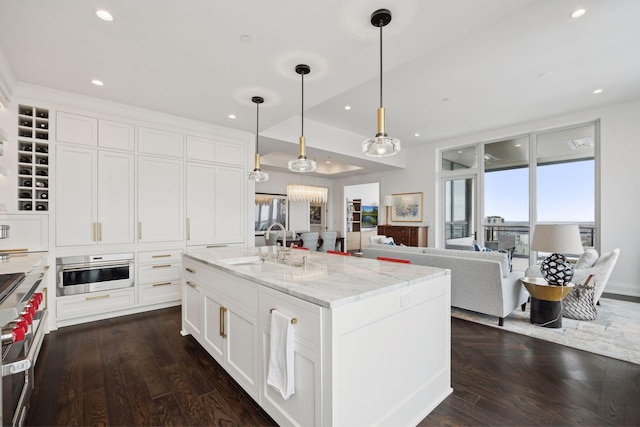 1111 River Pkwy Unit 26C, Minneapolis, MN 55415 - kitchen with recessed lighting, white cabinets, healthy amount of natural light, light stone counters, and a sink