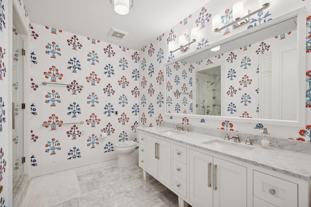 1111 River Pkwy Unit 26C, Minneapolis, MN 55415 - full bath with wallpapered walls, a shower stall, double vanity, and toilet