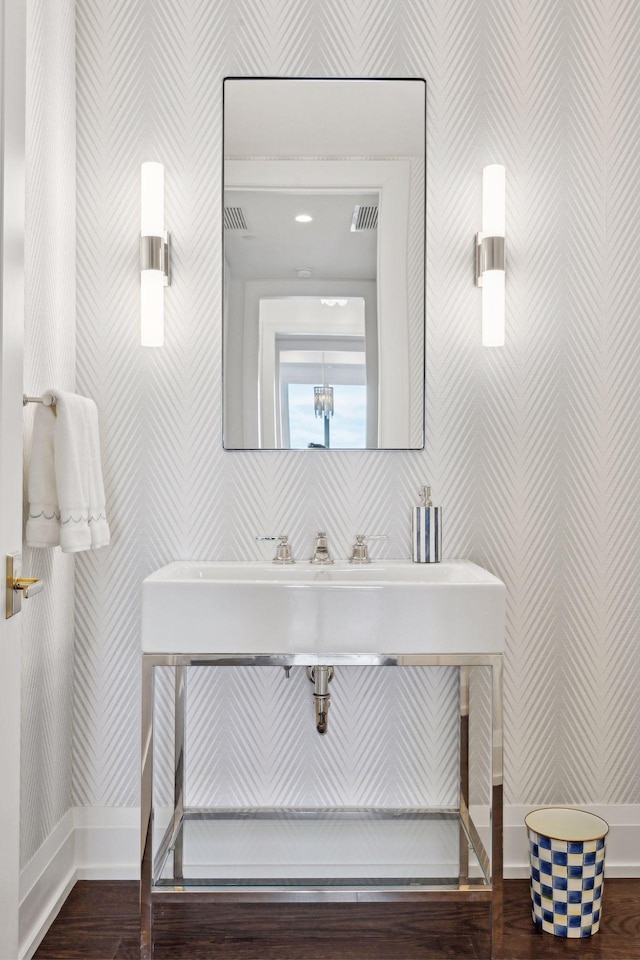 1111 River Pkwy Unit 26C, Minneapolis, MN 55415 - bathroom featuring wallpapered walls, baseboards, and wood finished floors