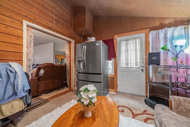 8712 Cottonwood Ln, Maple Grove, MN 55369 - living area featuring wood walls, carpet flooring, and vaulted ceiling