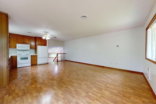 21341 County 50, Park Rapids, MN 56470 - unfurnished living room featuring light wood finished floors, ceiling fan, and baseboards