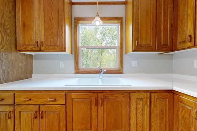 21341 County 50, Park Rapids, MN 56470 - kitchen featuring a sink, brown cabinets, and light countertops