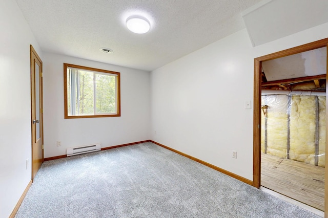 21341 County 50, Park Rapids, MN 56470 - unfurnished bedroom featuring a baseboard radiator, carpet floors, a textured ceiling, and baseboards