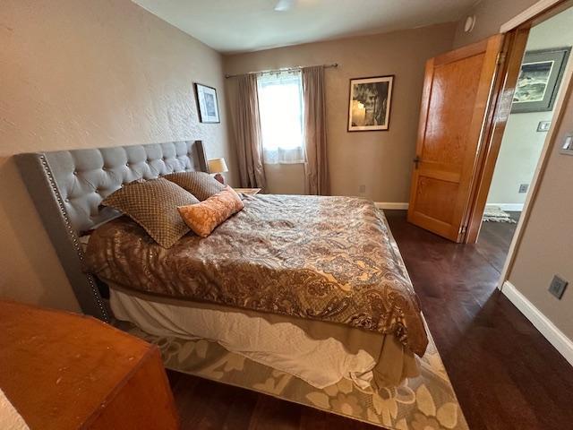 7 Shagawa Rd, Ely, MN 55731 - bedroom featuring dark wood-style floors and baseboards