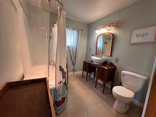 7 Shagawa Rd, Ely, MN 55731 - full bath with toilet, vanity, and baseboards
