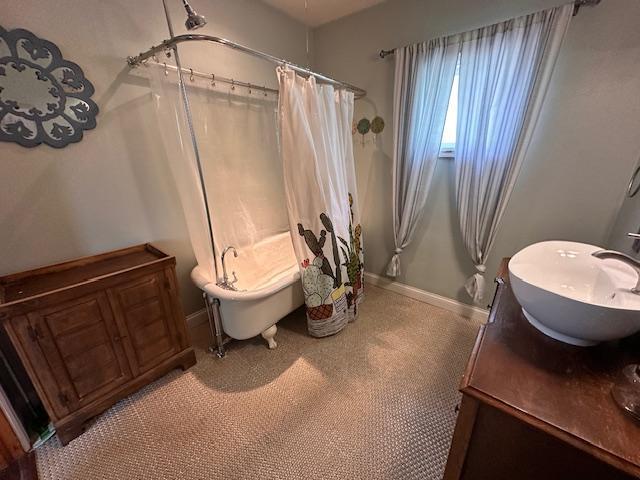 7 Shagawa Rd, Ely, MN 55731 - bathroom with baseboards and vanity