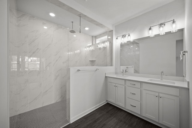 14648 105th Cir N, Maple Grove, MN 55369 - bathroom with a marble finish shower, double vanity, wood finished floors, baseboards, and recessed lighting