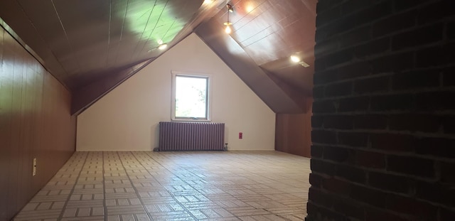 420 Spring St, River Falls, WI 54022 - bonus room featuring radiator heating unit and lofted ceiling