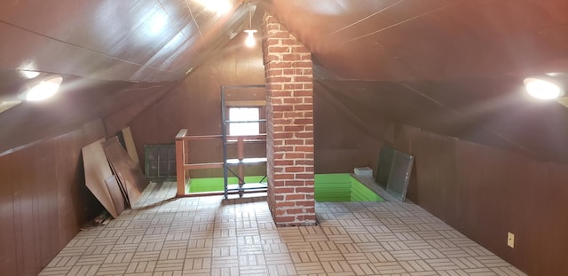 420 Spring St, River Falls, WI 54022 - bonus room with lofted ceiling and wood walls