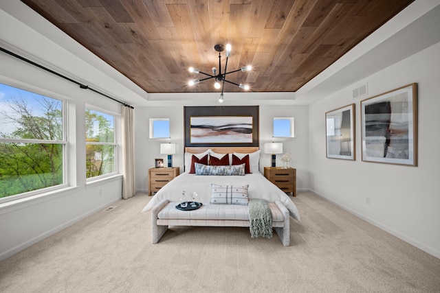 14810 106th Ave N, Maple Grove, MN 55369 - carpeted bedroom with wood ceiling, a raised ceiling, a chandelier, and baseboards