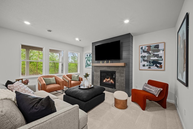 14810 106th Ave N, Maple Grove, MN 55369 - carpeted living room featuring a fireplace, baseboards, and recessed lighting