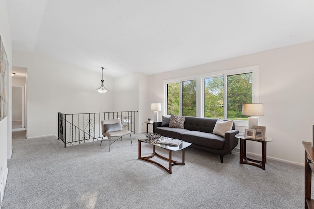 583 97th Ln NE, Blaine, MN 55434 - living area with carpet floors, lofted ceiling, and baseboards