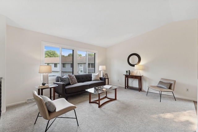 583 97th Ln NE, Blaine, MN 55434 - carpeted living room with vaulted ceiling and baseboards