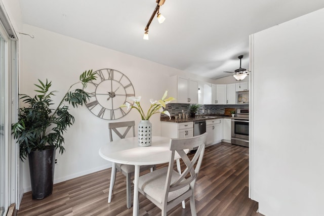 583 97th Ln NE, Blaine, MN 55434 - dining space with dark wood-type flooring, ceiling fan, and baseboards