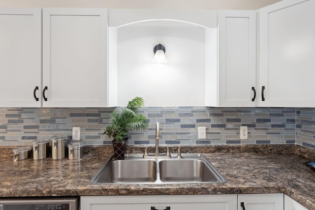 583 97th Ln NE, Blaine, MN 55434 - kitchen featuring white cabinetry, a sink, dishwasher, decorative backsplash, and dark stone countertops