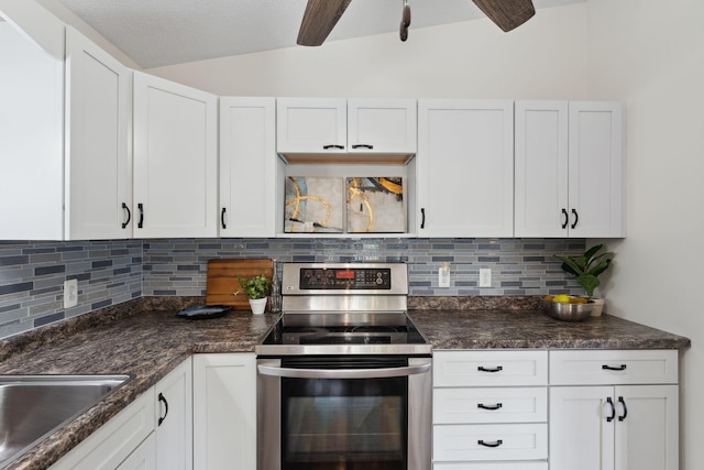 583 97th Ln NE, Blaine, MN 55434 - kitchen featuring electric range, a ceiling fan, white cabinets, tasteful backsplash, and vaulted ceiling