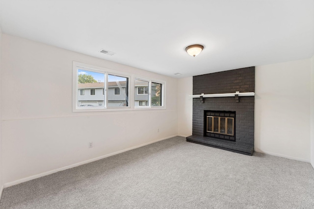 583 97th Ln NE, Blaine, MN 55434 - unfurnished living room featuring carpet floors, a brick fireplace, and baseboards