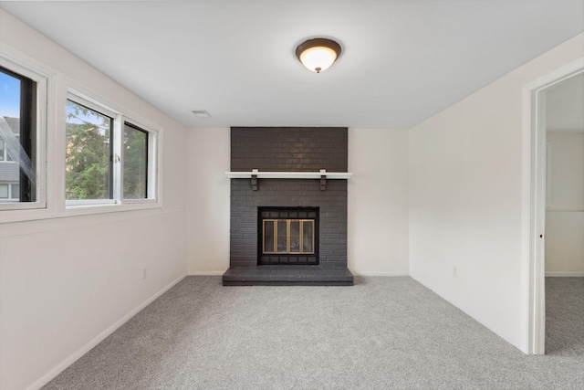 583 97th Ln NE, Blaine, MN 55434 - unfurnished living room with carpet, a fireplace, and baseboards
