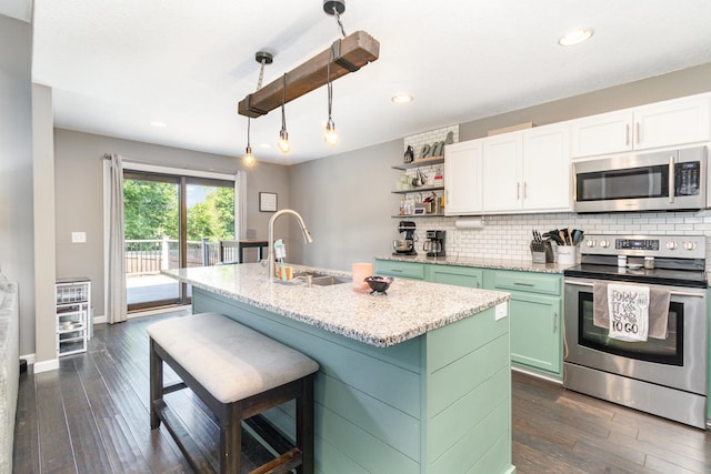414 Bremen Pass, Waverly, MN 55390 - kitchen with appliances with stainless steel finishes, a sink, open shelves, white cabinets, and backsplash