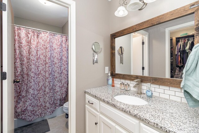 414 Bremen Pass, Waverly, MN 55390 - full bathroom featuring vanity, backsplash, toilet, and a shower with curtain