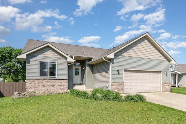 414 Bremen Pass, Waverly, MN 55390 - view of front of home featuring brick siding, an attached garage, and concrete driveway