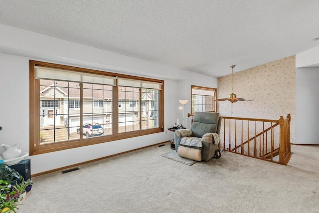 1977 Granite Ave N, Oakdale, MN 55128 - living area with an upstairs landing, carpet floors, baseboards, and a textured ceiling