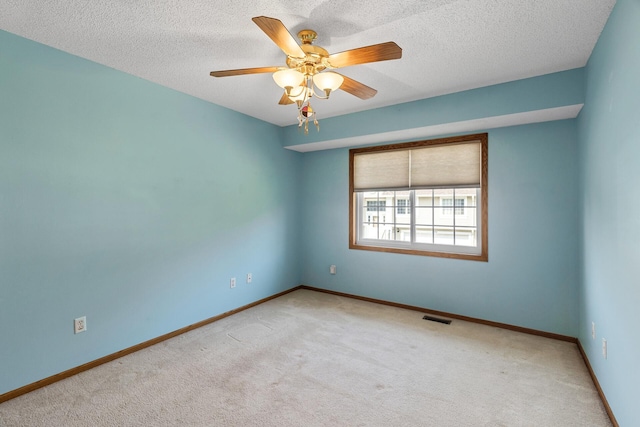 1977 Granite Ave N, Oakdale, MN 55128 - carpeted empty room with a ceiling fan, baseboards, and a textured ceiling