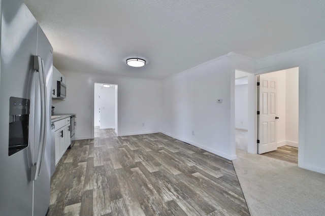 32736 203rd Ave, Clarissa, MN 56440 - kitchen with stainless steel appliances, white cabinets, wood finished floors, a textured ceiling, and light countertops