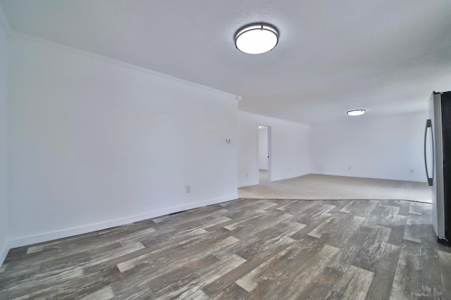 32736 203rd Ave, Clarissa, MN 56440 - spare room featuring wood finished floors, a textured ceiling, and ornamental molding