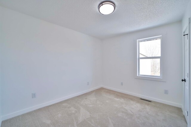 32736 203rd Ave, Clarissa, MN 56440 - empty room featuring a textured ceiling and light colored carpet