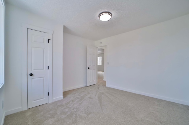 32736 203rd Ave, Clarissa, MN 56440 - carpeted spare room with a textured ceiling and baseboards