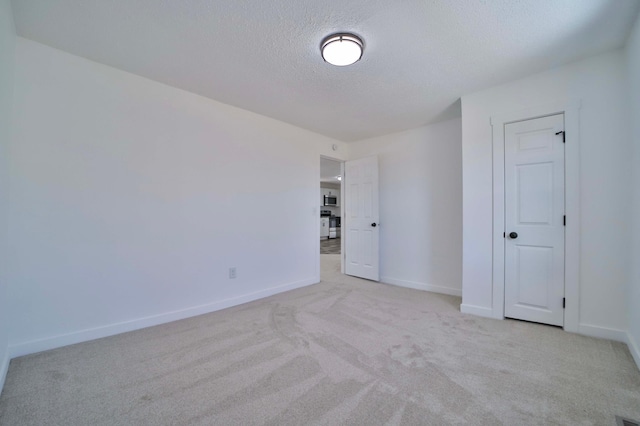 32736 203rd Ave, Clarissa, MN 56440 - unfurnished room featuring light colored carpet and a textured ceiling