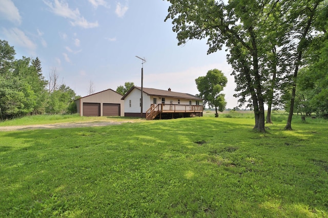 32736 203rd Ave, Clarissa, MN 56440 - view of grassy yard with an outbuilding, a deck, and a garage