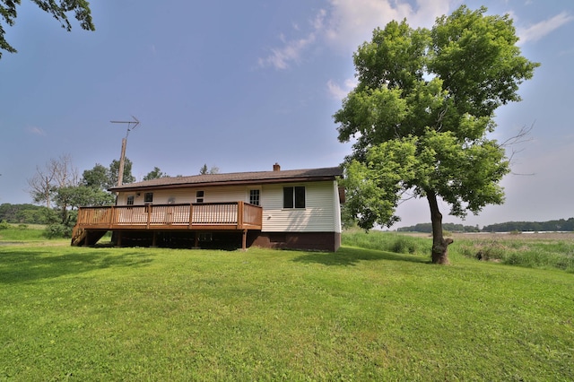 32736 203rd Ave, Clarissa, MN 56440 - rear view of property with a wooden deck, a lawn, and a chimney