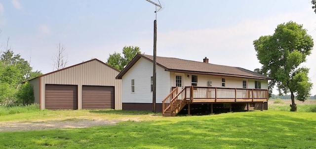 32736 203rd Ave, Clarissa, MN 56440 - back of house with a deck, a yard, a detached garage, and a chimney
