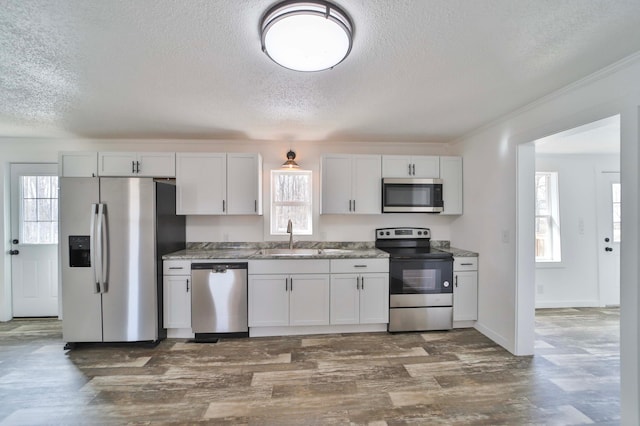 32736 203rd Ave, Clarissa, MN 56440 - kitchen with stainless steel appliances, a textured ceiling, and dark wood-style floors